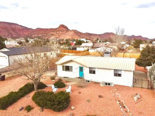 an aerial view of a white house in the desert at Sandstone Gazing big backyard Sleeps 10 in Kanab