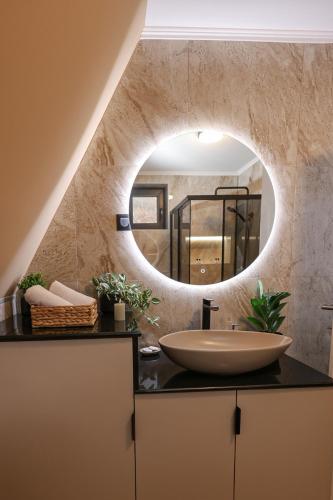 a bathroom with a sink and a mirror at "Vista Frame" JAZ - lake view in Višegrad