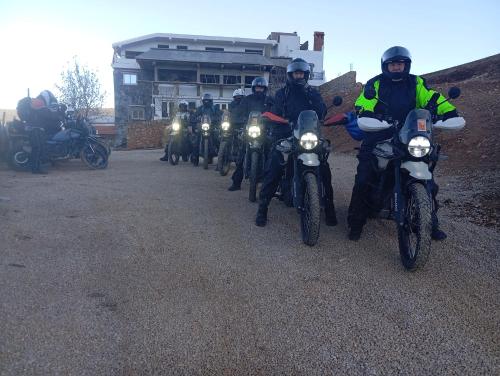 a group of people riding motorcycles on a road at Le Gite du Barrage in Zaouia Ben Smine