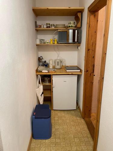 a small kitchen with a small refrigerator and a microwave at Gasthaus Liam 3 in Bendorf