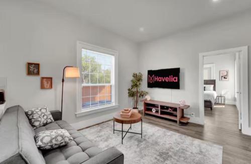 a living room with a couch and a table at Downtown Dallas 1BD Haven in Dallas