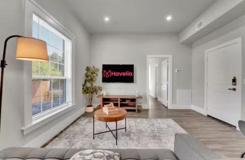 a living room with a couch and a table at Downtown Dallas 1BD Haven in Dallas