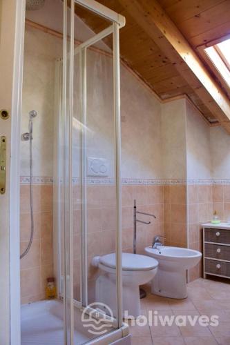 a bathroom with a shower and a toilet and a sink at Appartamento Ad Navalia in Varazze