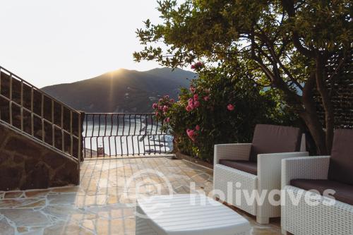 a balcony with a table and chairs on a patio at La casa di Luisa in Moneglia