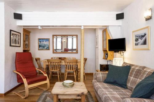 a living room with a couch and a table at Résidence Igloo in Chamonix