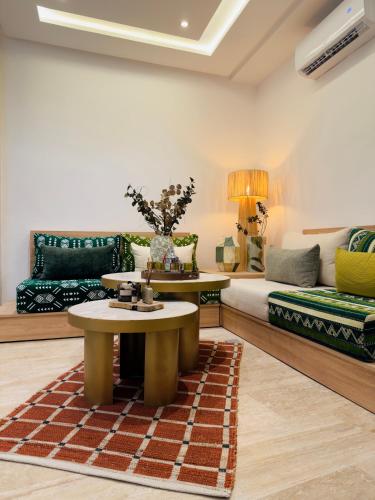 a living room with a couch and a table at RIAD El Ma in Marrakesh
