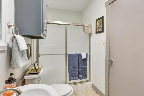 a bathroom with a shower and a toilet and a sink at Private Boat Launch! Riverfront Jefferson Retreat in Jefferson