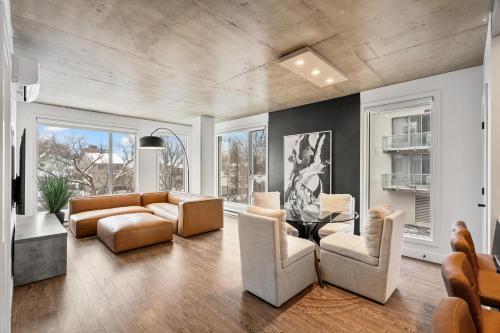 a living room with a couch and chairs at Westview Luxury Suites - Downtown Ottawa Gatineau in Gatineau