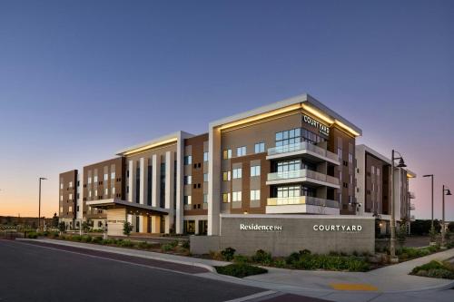 a rendering of a building on a street at Courtyard by Marriott Sand City Monterey in Sand City