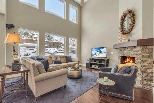 a living room with couches and a fireplace at Charming 3BR-Near Skiing & Hiking in Kamas