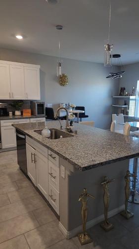 a kitchen with a sink and a counter top at Furnished Private Room in Las Vegas