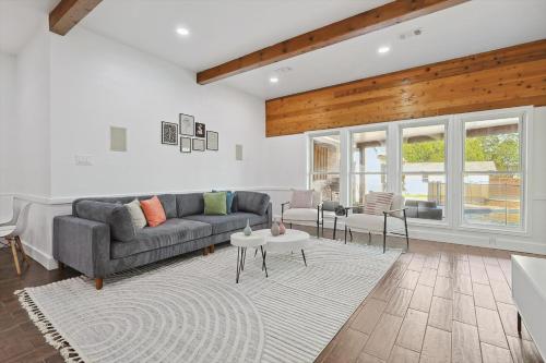 a living room with a couch and a table at Gorgeous 4BR Home with Huge Yard Pool in Denton