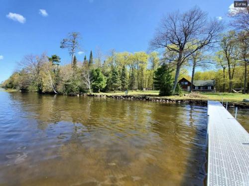 a view of a river from a dock at Grace Place in Watersmeet