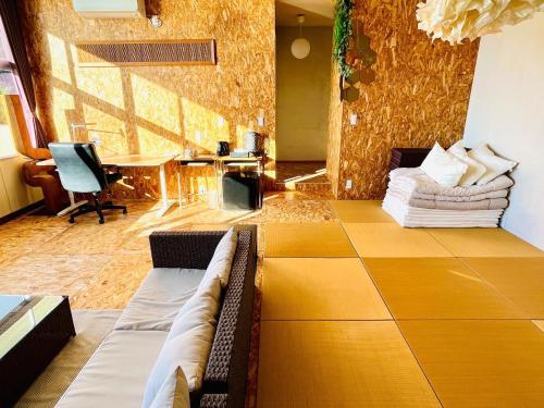 a living room with a couch and a table at Agri Museum NADA - Vacation STAY 40517v in Minamiawaji
