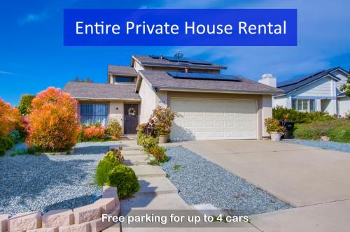 a house with a driveway in front of it at Entire Private Home with 4 Bedrooms - 3 Bathrooms, Big Yard, Garage, King Bed, Crib, Available Now in San Diego