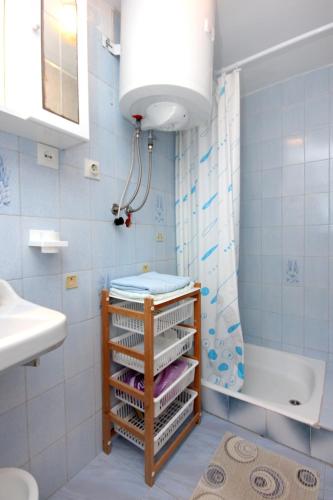 a bathroom with a sink and a toilet and a shower at Apartment Rogacic 2460a in Vis