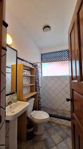 a bathroom with a toilet and a sink at noemi apartments samara beach A-2 in Sámara