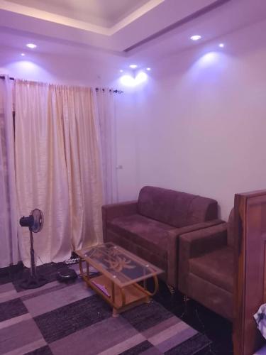 a living room with a couch and a table at Gassama studio in Dakar