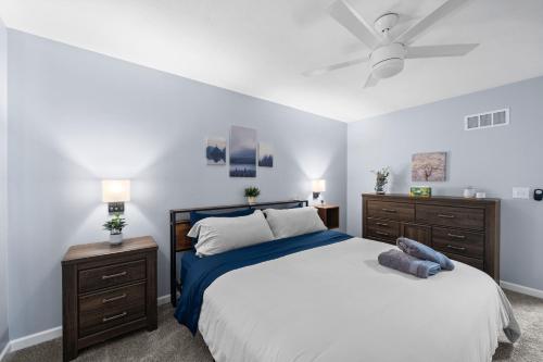 a bedroom with a large bed and two night stands at New Spacious Renovated Townhouse in Spring Hill