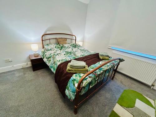 a bedroom with a bed in a room at Rural boutique private flat in Bedford