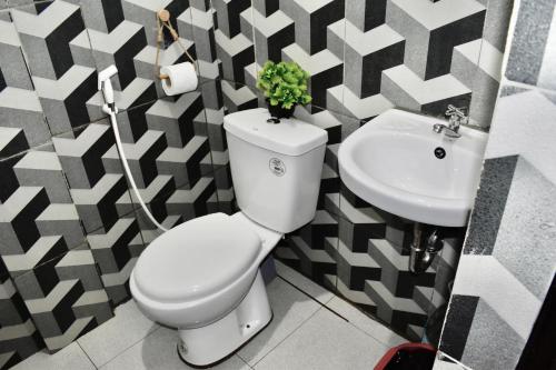 a bathroom with a toilet and a sink at Apartment El Nido in El Nido