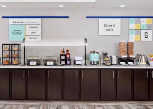 a counter in a room with a counter top at Garner Hotel Albuquerque Airport by IHG in Albuquerque