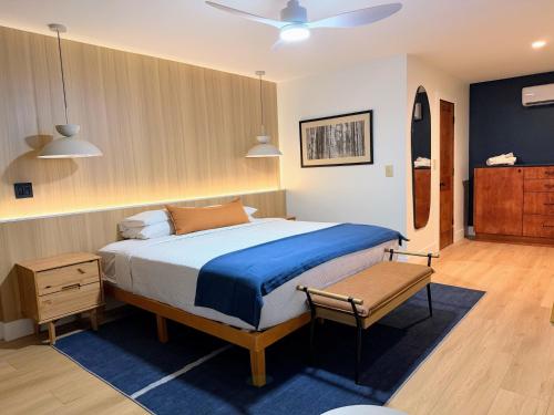 a bedroom with a large bed with a blue blanket at The Iceberg Tahoe in South Lake Tahoe