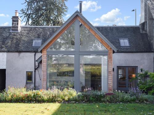 an extension to a house with large windows at Rowanlea in Muthill