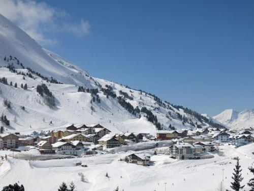 a small town in the snow on a mountain at Haus Vinzenz in Obertauern