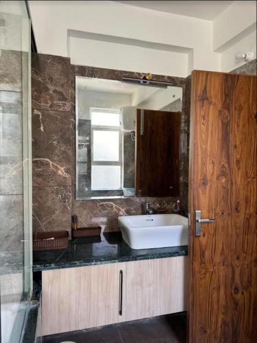 a bathroom with a sink and a mirror at Entire 4bhk villa in Panchkula, Chandigarh in Panchkula