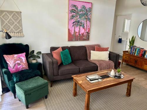 a living room with a couch and a coffee table at Sunshine Four in Salisbury