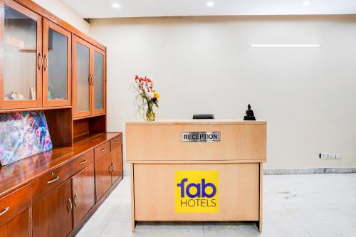 a mobo houston sign on a podium in a room at FabHotel Sarala Residency in Noida