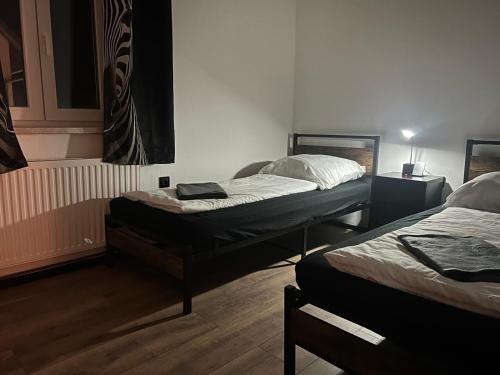 a room with two beds in a room at Haus Vranjes in Rosenau am Hengstpass