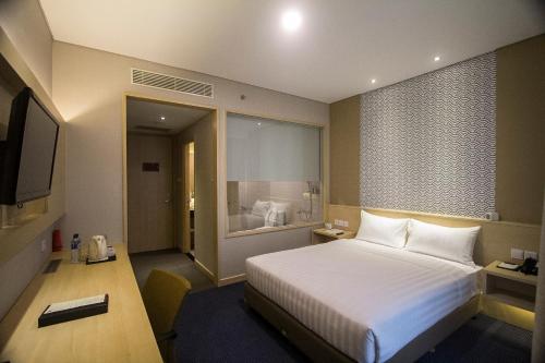 Postel nebo postele na pokoji v ubytování GTV Hotel