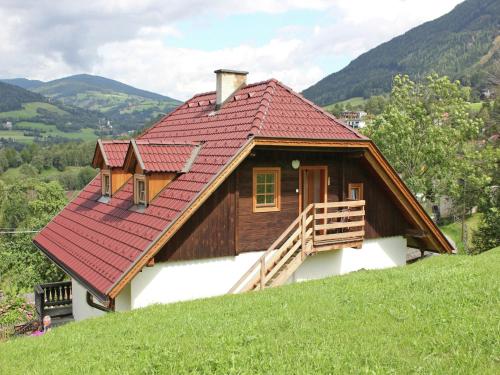 a house with a red roof on top of a hill at Peaceful Cottage near Ski Area in Gmünd in Gmünd in Kärnten