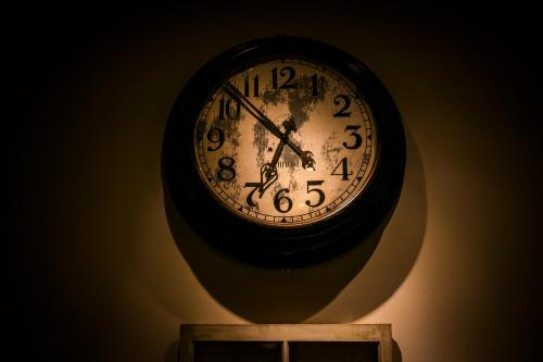 a clock is hanging on a wall at Sotetsu Fresa Inn Ginza-Nanachome in Tokyo