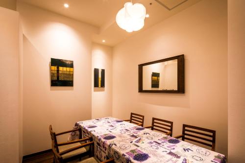 a dining room with a table and chairs at Sotetsu Fresa Inn Ginza-Nanachome in Tokyo