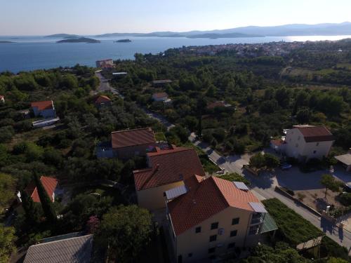 an aerial view of a house and the water at Apartments Maestral in Orebić