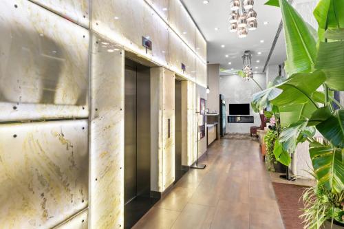an empty hallway with plants in a building at Comfort Inn Prospect Park-Brooklyn in Brooklyn