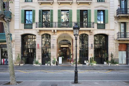 a building with a street light in front of it at Hotel Casa Bonay & Spa in Barcelona