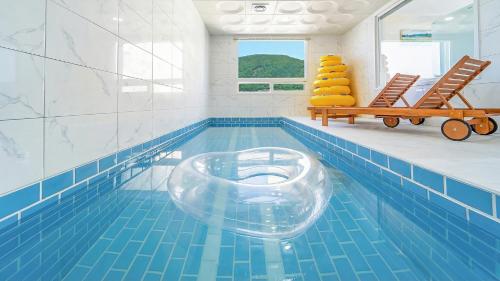 a swimming pool with a bowl in the middle of it at Gapyeong Boreum-Dal Poolvilla in Gapyeong