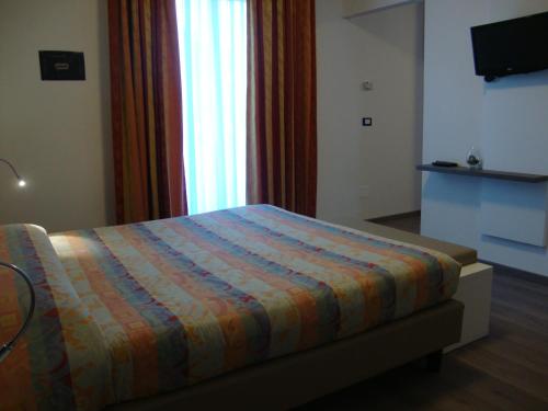 Postel nebo postele na pokoji v ubytování Hotel Venezia