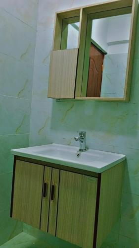 a bathroom with a sink and a mirror at Taita Rocks Hotel in Wundanyi