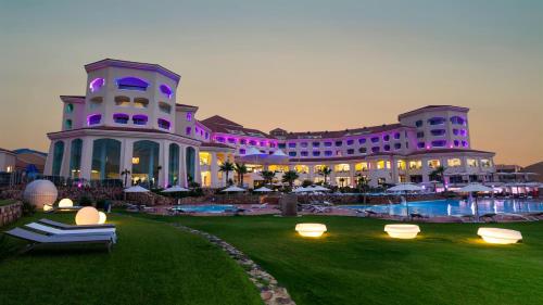 a large building with a pool in front of it at La Cigale Tabarka in Tabarka