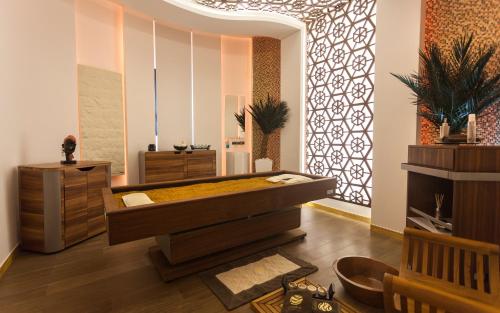 a jacuzzi tub in a room with a wall at La Cigale Tabarka in Tabarka
