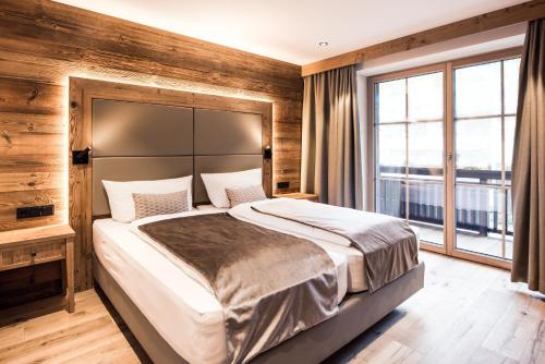 Postel nebo postele na pokoji v ubytování Pepi's Suites - Lechtal Apartments