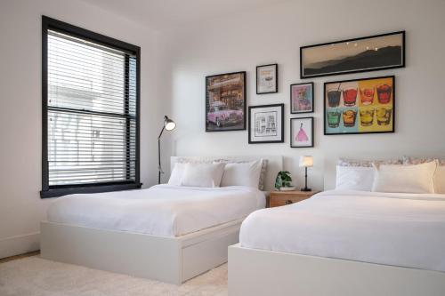 two white beds in a room with a window at Gorgeous Apartment 2-bedroom 2-bathroom in Los Angeles