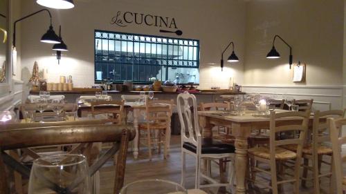 a restaurant with tables and chairs and a bar at L'Antico Lido Venice in Venice-Lido