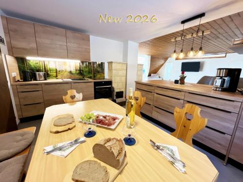 a kitchen with a table with a plate of food on it at Almhütte Grosserhütte in Katschwald