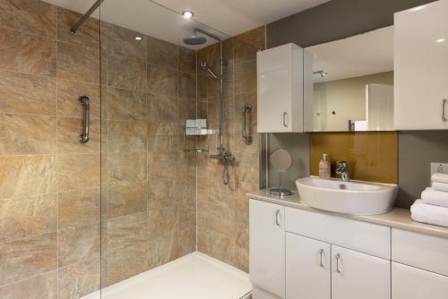 a bathroom with a sink and a shower at Easy Oars - Flushing, Falmouth in Flushing